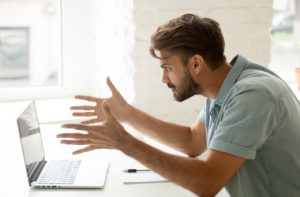 man angry to laptop